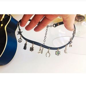 Sweet Romance leather charm necklace. never worn.